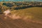 The process of preparing the land for sowing cultivated plants, view from the top of the field cultivation process, Ukrainian