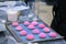 Process of preparing pink shortbread cookies at bakery