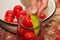 The process of preserving tomatoes for the winter. Female hands stack ripe red juicy tomatoes in glass jars