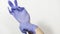 Process of putting on hands blue latex sterile gloves on hands, concept of safety and protection