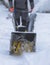 Process of removing snow with portable blower machine, worker dressed in overall workwear with gas snow blower removal on the