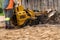 The process of removing a tree stump where the rotating head of the stump cutter grinds a freshly sawn stump...The blades of the