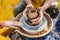 Process of rotation of potter`s wheel, hands of ceramist