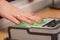 The process of scanning fingerprints during the check at border crossing. Female hand puts fingers to the fingerprint scanner.