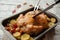 The process of slicing the finished dish, fried, crispy chicken into portions for the thanksgiving holiday