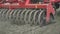 Process sowing plowed field with sowing equipment. Farming machinery