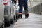 Process of urban street cleaning sweeping. Worker with broom and dust pan