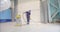 The process of vacuuming a polymer floor after finishing work. Cleaning the construction site from dust. A builder