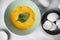 The process whisking egg yolks, making tasty egg omelet with green spinach for breakfast on white background. Idea