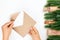 process of writing and sending letter to Santa Claus, craft envelope and frame of Christmas tree branches with gift