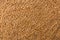 Processed organic wheat grains texture background