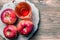 Processing of an agricultural crop of red and green apples. Home canning, healthy diet vegetarian food. Apple cider vinegar, juice