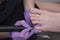 Processing toenails, pedicure. Gloved hands with a pedicure cutter. Close-up