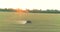 Processing a wheat field with pesticides. View from a drone. Tractor treats wheat field with pesticides