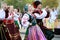 Procession of students of the Institute of culture, dancers in Cossack traditional dress, colored skirt, green trousers and maroon