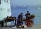 PROCIDA, ITALY, 1974 - Italian postman with cart and horse with postal sacks on the pier of Procida