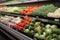 Produce diversity assorted vegetables on display for sale in supermarket