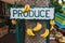 Produce Sign With Hanging Bananas