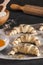 Producing classic small croissants at home or cafe. French pastry goods. Family cooking concept. Prepare croissant for bake