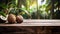 Product display rustic old wooden boards table with coconut farm in background.