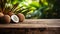 Product display rustic old wooden boards table with coconut farm in background.