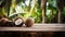 Product display rustic old wooden boards table with coconut farm in background.