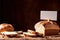 Product packaging mockup photo of bread with blank white card, studio advertising photoshoot