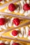 Product photography of lemon cheesecake with raspberries on white background, zig zag pattern of cake slices