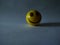 Product Photography of Smile Joker Ball Under Shadow Light