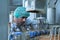 Product quality control officer in fruit juice production line Carry out an inspection of bottles used to contain fruit juices