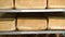 Production of bakery products close up. Freshly baked ruddy bread close up, lying on the shelves at the factory in the