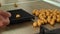 Production of homemade fresh boilies for carp fishing, rolling balls close up