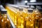 Production line fills glass bottles with vibrant apple and pineapple juice beverages