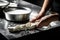 Production process of mozzarella cheese. woman working in a small family creamery is processing the final steps of making a cheese