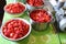 Production of tomato juice at home. Sliced tomatoes in pots.