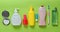 Products for beauty, self-care and hygiene on a green pastel background. Shampoo, perfume, lipstick, shower gel, toothbrush.