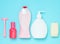 Products for the care of body, hair and personal hygiene on a blue pastel background. A bottle of fragrant perfume, lotion