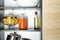 Products and kitchen utensils on shelving unit