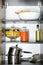 Products and kitchen utensils on shelving unit