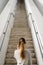 Profesional woman towards long stairs for business success concept