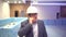 Profession, business and telecommunications, architect talking on cell phone and walking in construction site.