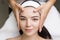 Professional anti-aging facial massage. Action. Relaxing facial treatment at Spa