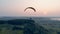 Professional athlete sailplanes in sky.