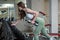 Professional athletic woman pumping up muscules. Exercise with dumbbells in gym interior. Fitness sexy female in fashion