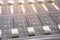 Professional audio mixing console with faders and adjusting knobs - radio