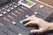 Professional audio mixing console with faders and adjusting knobs - radio