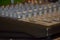 Professional audio mixing console with faders and adjusting knobs,TV radio and sound equipment  selective focus