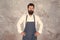 professional baker in apron. serious barista with beard. advertisement and food. cook wear professional apron. express