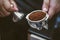 Professional baristas prepare coffee beans.