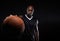 Professional basketball player against black background